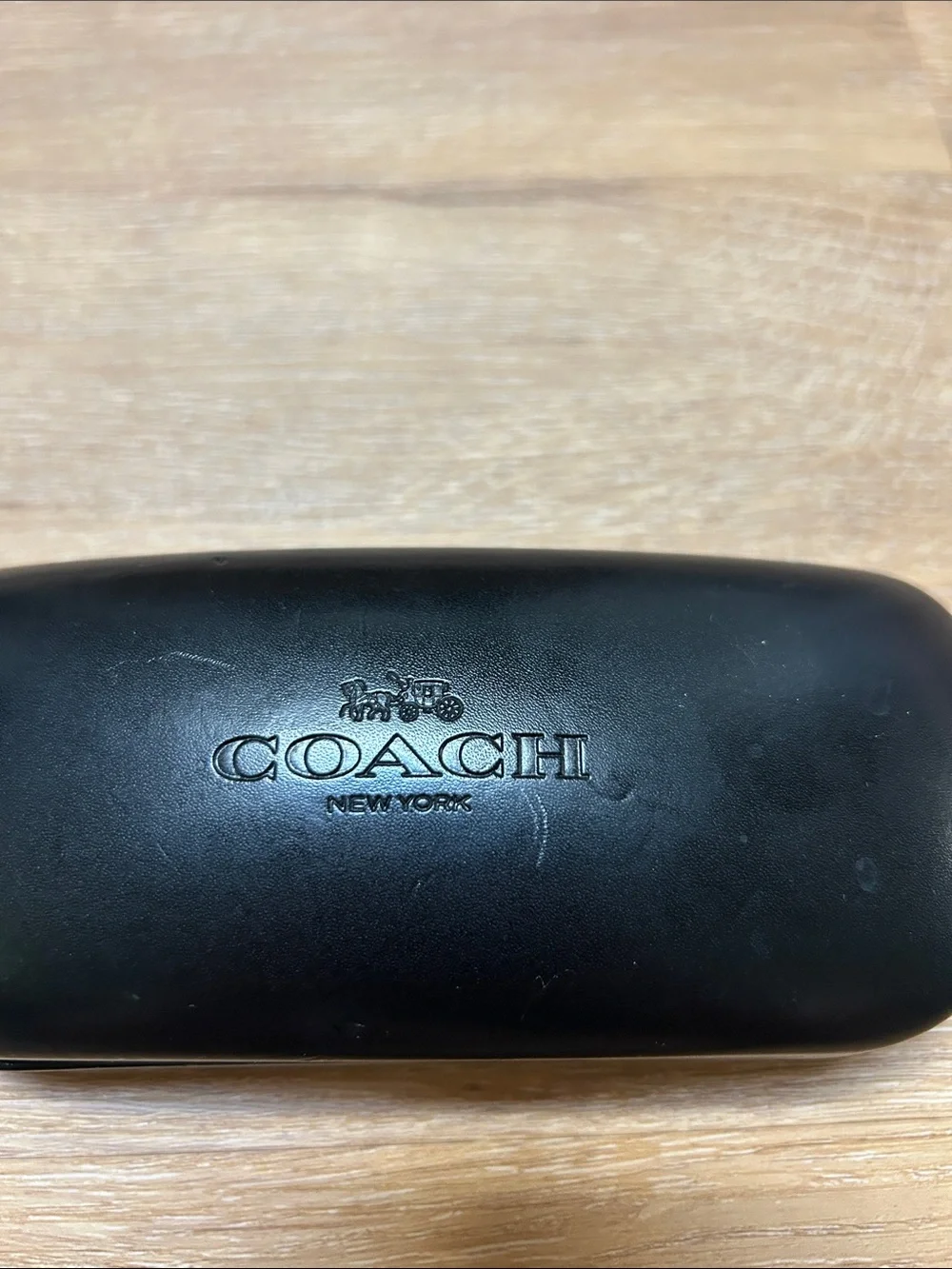 Coach sleek black